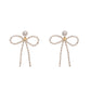 BIG BOW- Orecchini fiocco con perle
